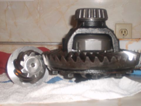 1989 Ford Bronco - Differential gears and pinion are shown on a towel, likely for repair or inspection.