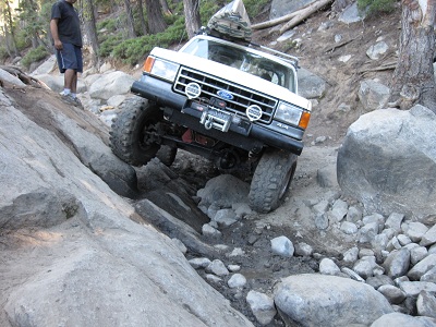 1991 Ford Bronco - This 1991 Ford Bronco is tackling a challenging off-road course with steep inclines and large rocks.