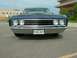 1969 Ford Torino - This sedan's front end features a prominent grille and headlights, with a license plate below the bumper.