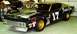 1969 Ford Torino - A dark race car, identified by the number 17 on its side and gold wheels, is viewed from a three-quarter front angle.