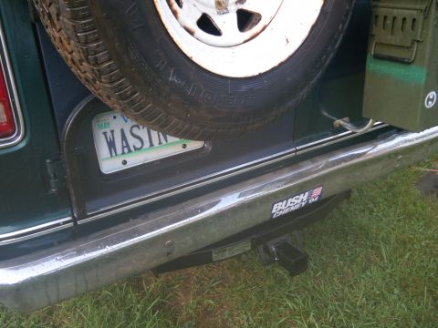1981 Ford E350 - A spare tire is mounted on the rear of a van, obscuring the license plate.