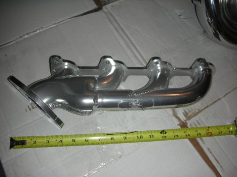 1998 Ford Crown Victoria - A Ford exhaust manifold is shown with a tape measure for scale.