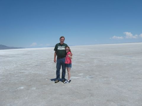 1972 Ford Ranchero - A man and a girl pose for a photo on a bright, sunny day in a wide-open, flat landscape.