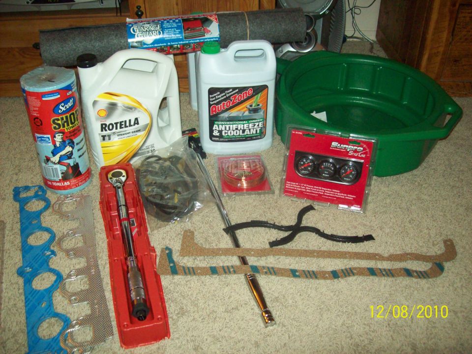 Automotive parts including oil, coolant, torque wrench, gaskets, and gauges