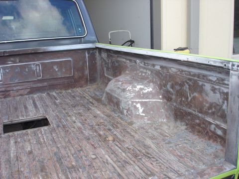 1979 Ford F-250 - The bedliner of a 1979 Ford F-250 shows significant wear and tear, indicating it has seen heavy use.