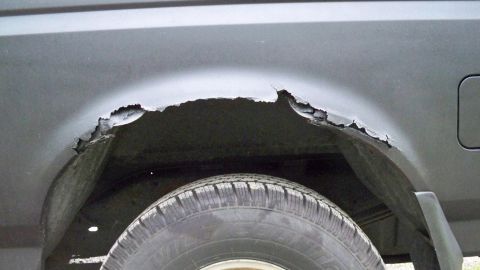 1994 Ford Bronco - Significant rust damage is visible around the wheel well of this vehicle.