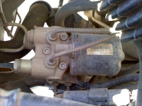 1996 Ford Bronco - This is a close-up view of a vehicle's ABS actuator, showing its complex mechanical and electrical connections.
