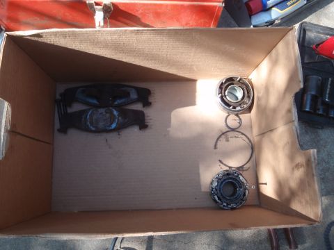 1994 Ford Bronco - Box contains brake pads and wheel bearings, possibly for a vehicle repair.