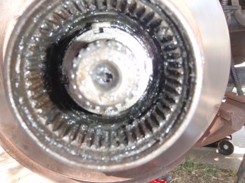 1994 Ford Bronco - Close-up view of a wheel hub's internal splines, covered in grease.