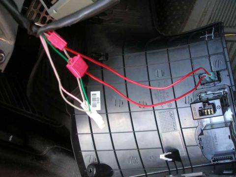 2010 Hyundai Genesis - Close-up of car interior wiring harness with multiple connectors and wires visible.