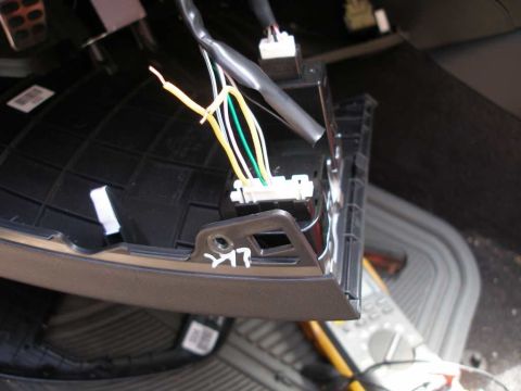 2010 Hyundai Genesis - Close-up view of a car's interior wiring harness, showing multiple colored wires connected to a central component.