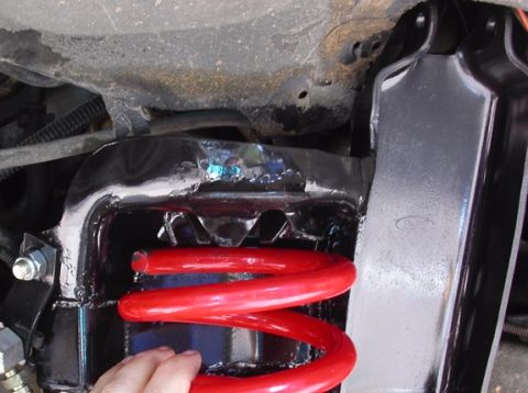 1990 Ford Bronco II - Fitting the coil to the mount. These coils are approx half-inch larger diameter than the stock TTB coils (notice the tab welded right at th…
