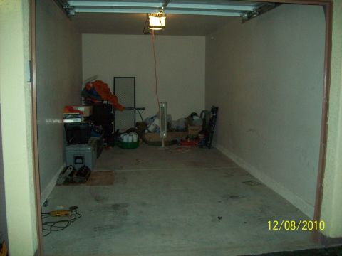 1985 Ford Bronco - This garage scene contains various stored items and a date stamp, but no vehicles are visible.