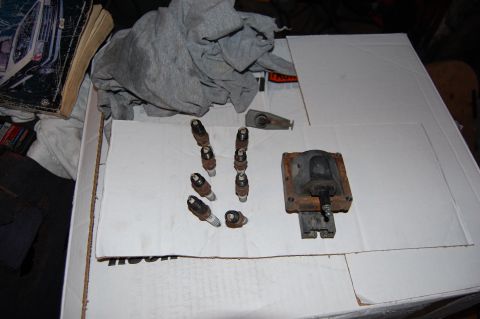 1994 Ford Bronco - Old Autolite Platinum plugs, coil, and rotor removed. The coil has a large pit worn in the terminal.