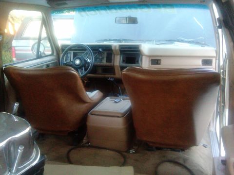 1986 Ford Bronco - Interior view of a 1986 Ford Bronco, highlighting the front seats and dashboard.