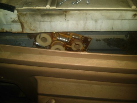 1986 Ford Bronco - A close-up view of an electronic component, possibly a crossover, located within the vehicle's interior structure.