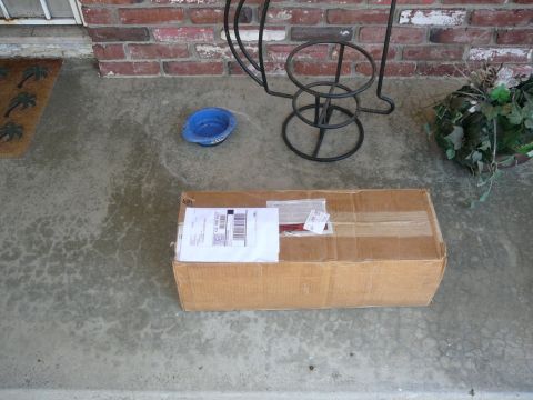 1988 Ford Bronco - A package sits on a porch, awaiting pickup or delivery.
