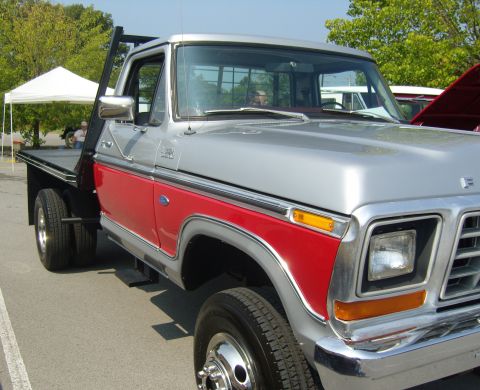 2007 Ford Mustang - This Ford flatbed truck has a two-tone paint scheme with red accents.