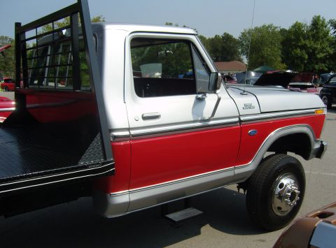 2007 Ford Mustang - This classic Ford F-Series truck features a two-tone paint scheme with a red lower body and silver upper cab.
