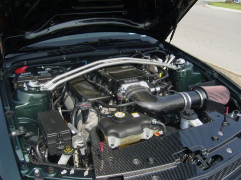 2007 Ford Mustang - Engine bay of a 2007 Ford Mustang, a supercharger and custom intake.
