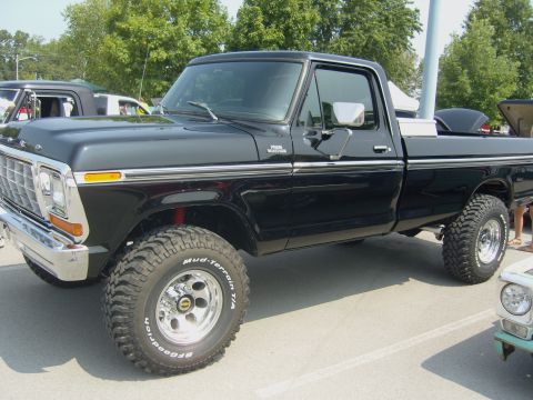 2007 Ford Mustang - This lifted black 1977 Ford F-150 pickup truck features BFGoodrich Mud-Terrain T/A tires and chrome wheels.
