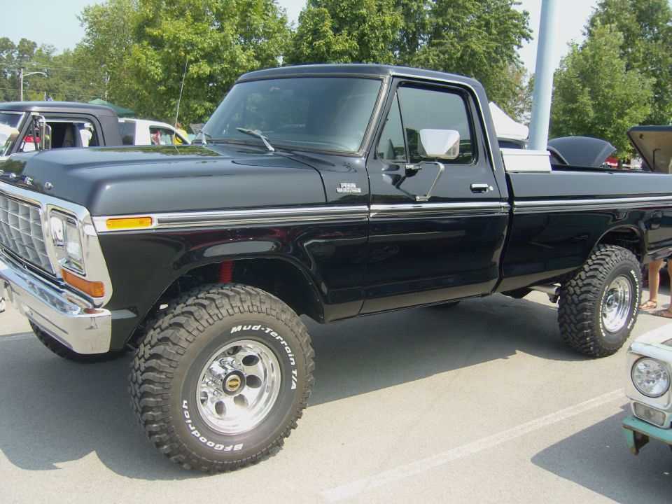 Black 1977 Ford F-150 pickup truck, lifted with off-road tires