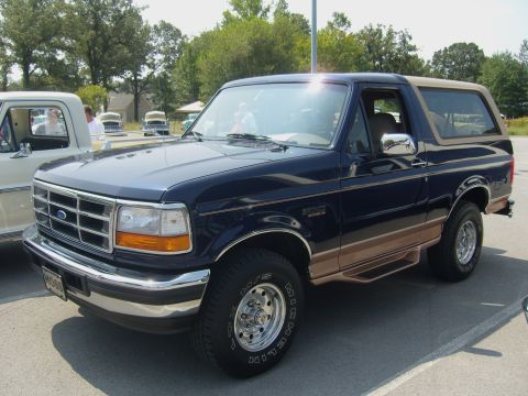 2007 Ford Mustang - This Ford Bronco is parked next to another vehicle in an outdoor lot.