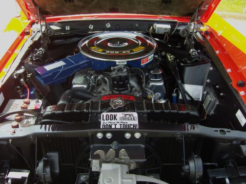 2007 Ford Mustang - The engine bay of a classic car, a prominent air cleaner and a humorous warning sticker.