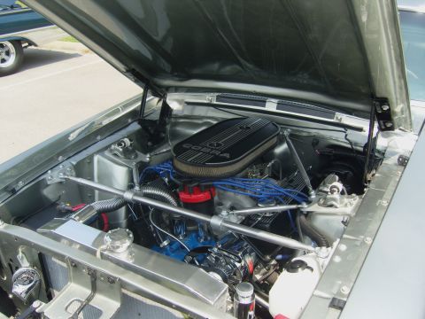 2007 Ford Mustang - The engine bay of a classic car, a V8 engine and a Cobra air cleaner assembly.