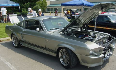 2007 Ford Mustang - Classic 1967 Ford Mustang GT500 displayed with its hood open at an outdoor car show.