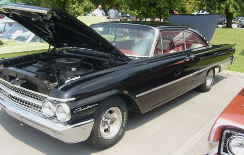 2007 Ford Mustang - A black 1960 Ford Starliner is displayed with its hood and trunk open, revealing its red interior and engine.