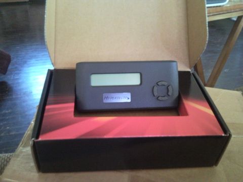 1988 Chevrolet Suburban - Hypertech electronic tuning device with LCD screen and directional buttons, shown in its box.
