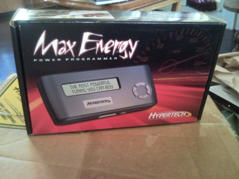 1988 Chevrolet Suburban - A box for a Hypertech Max Energy Power Programmer is shown, the device itself with tuning information displayed on its screen.