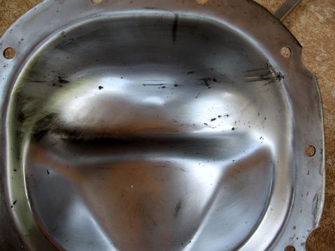 1995 Ford F-150 - This differential cover shows signs of impact and wear, suggesting it may have experienced gear problems.