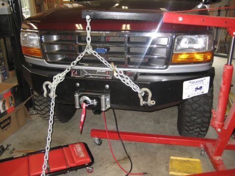 1996 Ford Bronco - Front view of a 1996 Ford Bronco equipped with a winch and heavy-duty chains.