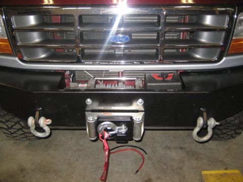 1996 Ford Bronco - Front view of a 1996 Ford Bronco showing the grille, bumper, and winch setup.