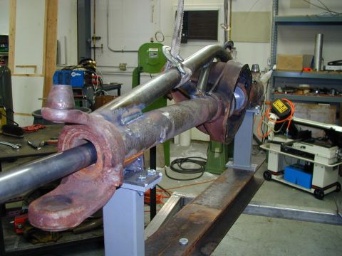 1979 Ford Bronco - Front axle assembly being worked on in a garage setting.