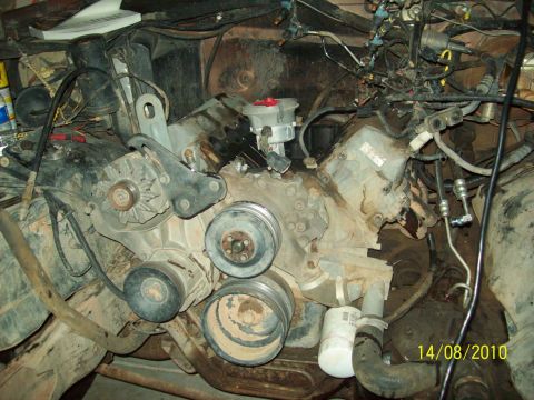 1985 Ford Bronco - Close-up view of a vehicle's engine compartment, showing various mechanical components and wiring.