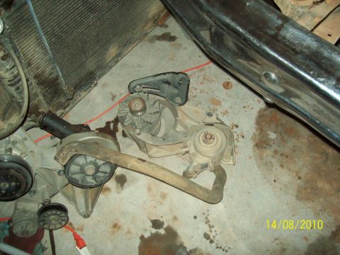 1985 Ford Bronco - Engine component assembly, likely from a Ford vehicle, shown on a concrete floor.