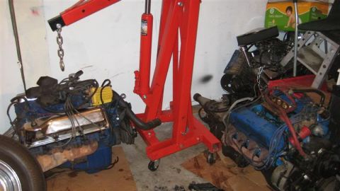 1968 Ford Ranchero - A garage scene with two disassembled engines and a red engine hoist, with a watermark at the bottom right.