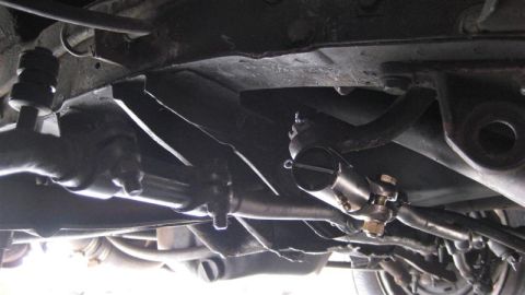 1968 Ford Ranchero - Close-up of the steering linkage components on the underside of a vehicle.