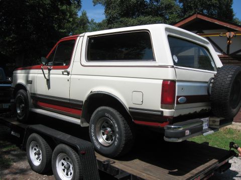 1987 Ford Bronco - This two-tone Ford Bronco is being transported on a trailer.