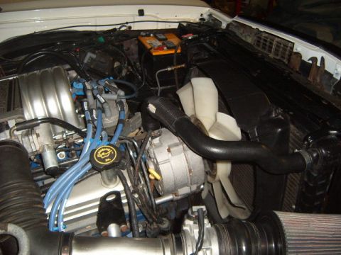 1973 Ford Ranchero - The engine bay shows various components including the battery, alternator, and cooling fan.