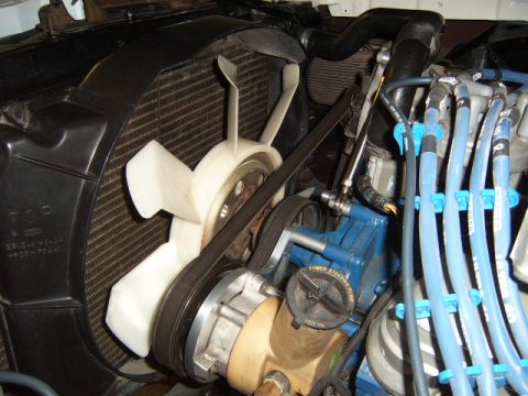 1973 Ford Ranchero - Close-up view of an engine bay, showing the radiator, fan, and various engine components.