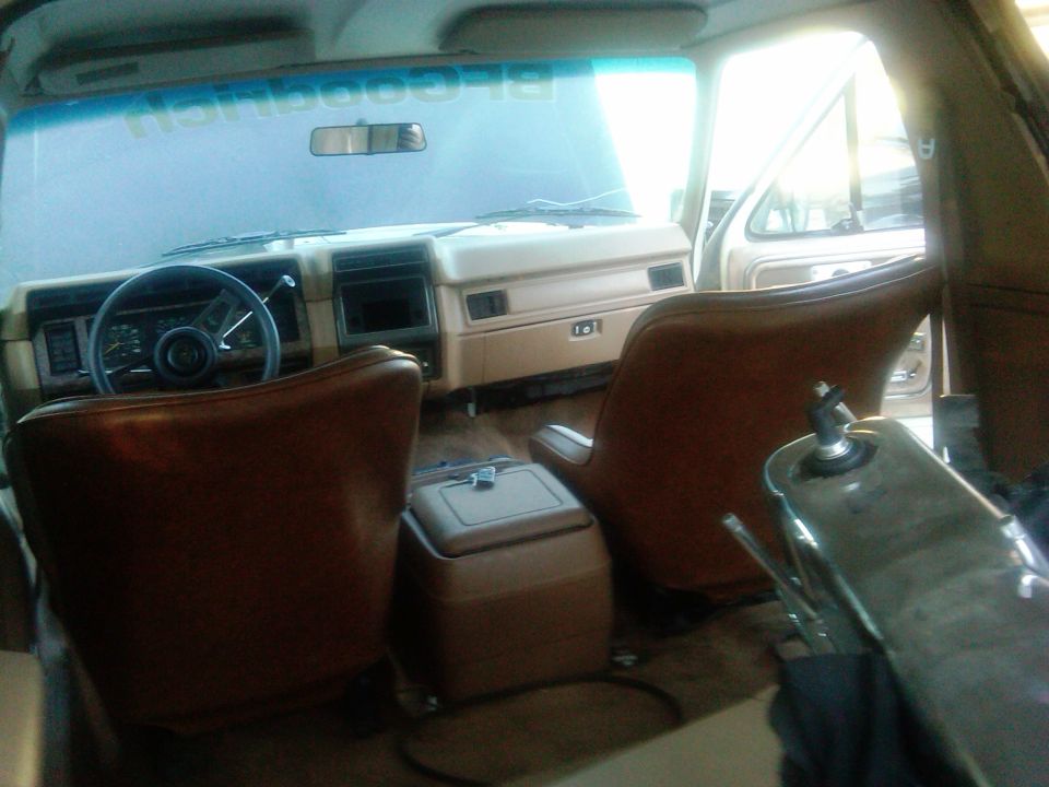 Interior of 1986 Ford Bronco with tan seats and dashboard