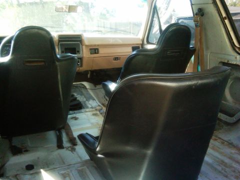 1986 Ford Bronco - Interior view of a 1986 Ford Bronco, highlighting the seats and dashboard area.