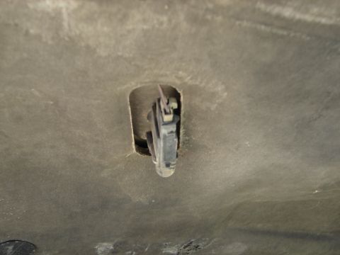 1992 Ford Taurus - The underside of a 1992 Ford Taurus hood shows the latch mechanism.