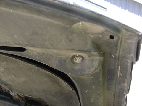 1992 Ford Taurus - The underside of a car hood is shown, with no clear year identification.