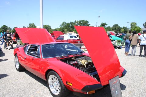1968 Shelby GT500 - A red sports car is displayed with its hood open at an outdoor car show.
