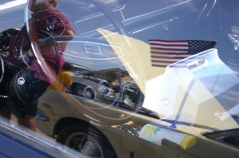 1968 Shelby GT500 - Interior view of a classic car, possibly a 1967 model, with an American flag displayed.